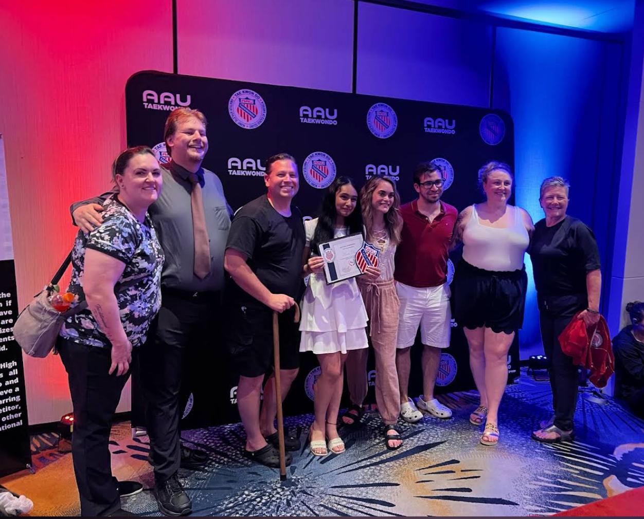 Siona with supporters following an AAU recognition event.