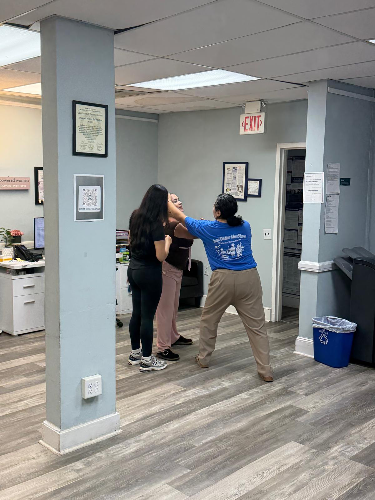 Women and girls participating in self-defense training